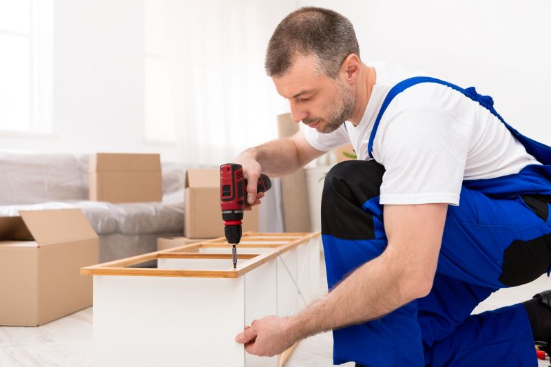 Technician assembling a wardrobe